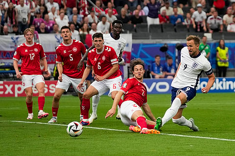 Harry Kane shoots past Denmark's Joachim Andersen